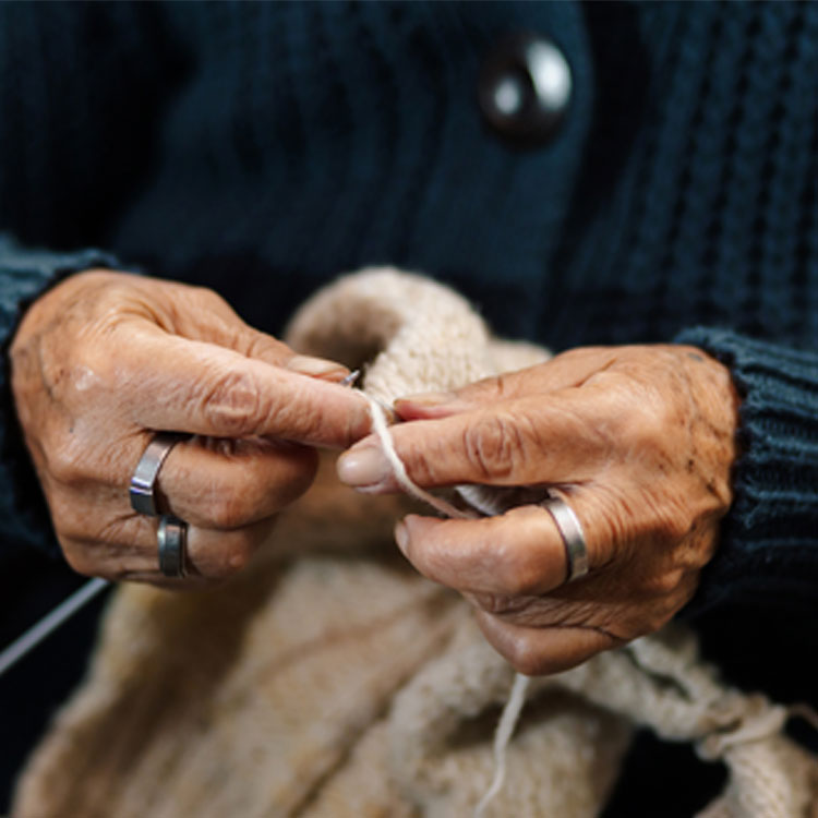 woman's hands knitting.