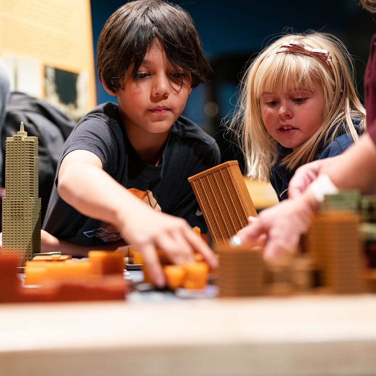 Two elementary-aged students playing with an interactive exhibit at the History Colorado Center.