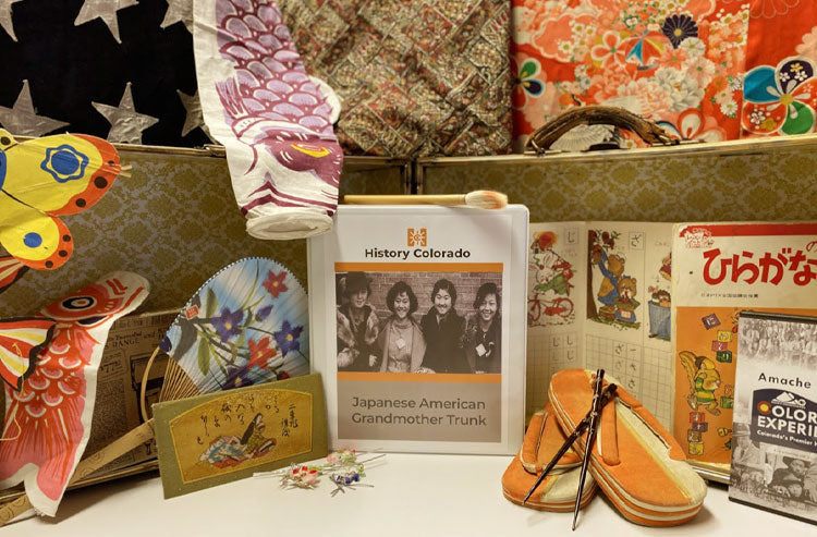 collage with Japanese paper fan, butterfly kite, jamapese samdles, chopsticks, and teachers guide in binder
