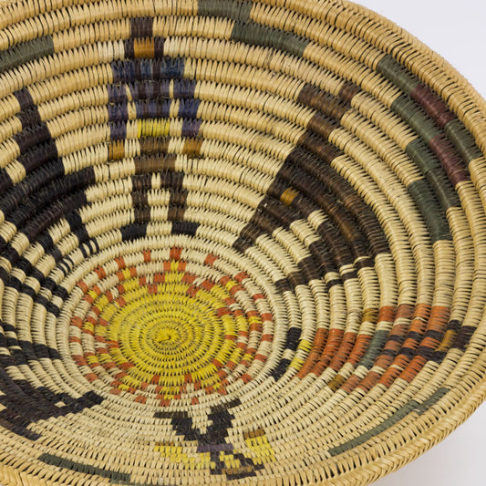 American Indian woven basket with image of sun