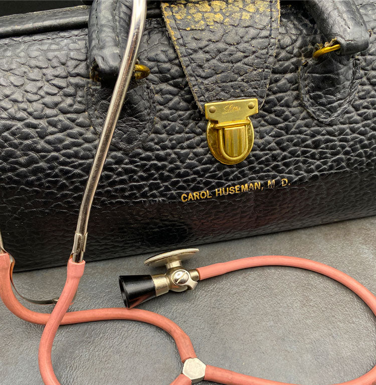 Leather doctor's bag with stethoscope.