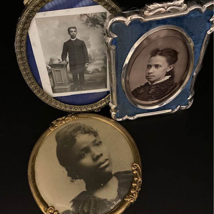 Framed photos of a man and two women from early 1900s. 