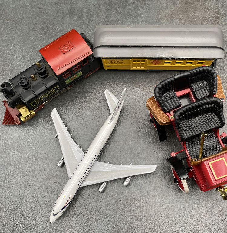 Toy train, airplane and model T car.